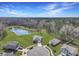 Aerial view of a residential area with a scenic pond and neatly arranged houses at 409 Spruce Ivy St, Moncks Corner, SC 29461