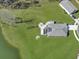 Overhead shot revealing a home with a patio, solar panels, and well-manicured lawn at 409 Spruce Ivy St, Moncks Corner, SC 29461