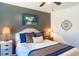 Comfortable bedroom with a stylish headboard, decorative pillows, and warm lighting at 409 Spruce Ivy St, Moncks Corner, SC 29461