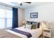 Bright bedroom featuring a large window, comfortable bedding, and stylish side tables at 409 Spruce Ivy St, Moncks Corner, SC 29461