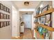Inviting hallway featuring stylish decor, wooden floors, and decorative wall shelving at 409 Spruce Ivy St, Moncks Corner, SC 29461