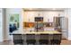 Modern kitchen with a marble island, stainless steel appliances, and sleek white cabinetry at 409 Spruce Ivy St, Moncks Corner, SC 29461