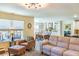 Open concept featuring a comfortable couch, stylish furniture, and open flow to dining area at 409 Spruce Ivy St, Moncks Corner, SC 29461