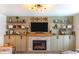 Stylish living room featuring a fireplace with stone surround and decorative built-in shelves at 409 Spruce Ivy St, Moncks Corner, SC 29461
