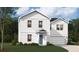 Charming two-story home with white siding, complemented by lush landscaping and a well-manicured lawn at 4139 Rising Tide Dr, Summerville, SC 29485