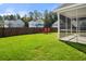 Fenced backyard with green grass and a swing on a sunny day at 416 Forest Hills Rd, Summerville, SC 29486