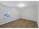 Bedroom features a large window for natural light and wood-look flooring at 416 Forest Hills Rd, Summerville, SC 29486
