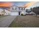 Two-story home featuring light gray siding, black shutters, and a well-maintained front yard, perfect for curb appeal at 416 Forest Hills Rd, Summerville, SC 29486