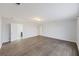 Spacious living room with wood-look floors, fresh paint and ample natural light at 416 Forest Hills Rd, Summerville, SC 29486