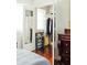 Bright bedroom featuring wood floors, a window, and an open closet at 42 1/2 Hasell St, Charleston, SC 29401