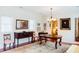 Dining area featuring hardwood floors, elegant chandelier and classic furnishings at 42 1/2 Hasell St, Charleston, SC 29401