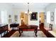 Bright dining room with hardwood floors, elegant chandelier and classic furnishings at 42 1/2 Hasell St, Charleston, SC 29401