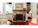 Living room showing a brick fireplace with built-in shelving at 42 1/2 Hasell St, Charleston, SC 29401