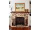Living room showcasing brick fireplace with decorative mantel and built-in shelving at 42 1/2 Hasell St, Charleston, SC 29401