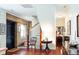 Elegant foyer featuring a staircase, exposed brick and hardwood floors at 42 1/2 Hasell St, Charleston, SC 29401