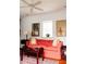 Bright living room featuring a patterned sofa and a ceiling fan at 42 1/2 Hasell St, Charleston, SC 29401