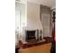 Fireplace in Primary bedroom featuring hardwood floors, neutral walls and natural light at 42 1/2 Hasell St, Charleston, SC 29401