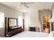 Spacious bedroom with dark wood furniture, fireplace and an organized closet at 42 1/2 Hasell St, Charleston, SC 29401