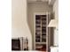 Well-organized closet and fireplace in Primary bedroom featuring hardwood floors and neutral walls at 42 1/2 Hasell St, Charleston, SC 29401