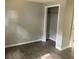 Bedroom with stylish gray laminate flooring and a closet space at 4230 S Rhett Ave, North Charleston, SC 29405
