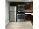 Modern kitchen with stainless steel appliances, dark cabinets, and plenty of counter space at 4230 S Rhett Ave, North Charleston, SC 29405
