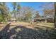 Spacious backyard with mature trees and firepit, inviting outdoor gatherings and relaxation at 425 Ravenwood Rd, Walterboro, SC 29488