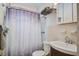 Functional bathroom featuring a shower with a patterned curtain, a sink, and a mirrored medicine cabinet at 425 Ravenwood Rd, Walterboro, SC 29488