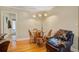 Cozy dining area featuring a wood table, chairs, and unique modern floor lamp in an inviting home at 425 Ravenwood Rd, Walterboro, SC 29488