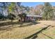 Quaint brick home surrounded by lush greenery and a peaceful setting at 425 Ravenwood Rd, Walterboro, SC 29488