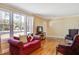 Bright and airy living room with hardwood floors, ample seating, and natural light at 425 Ravenwood Rd, Walterboro, SC 29488