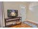 Cozy living room featuring hardwood floors and a television at 425 Ravenwood Rd, Walterboro, SC 29488