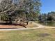 Picturesque community pond with playground and picnic areas nearby at 425 Ravenwood Rd, Walterboro, SC 29488