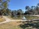 Beautiful pond with benches and walking path offers a relaxing spot in the neighborhood at 425 Ravenwood Rd, Walterboro, SC 29488