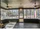 Enclosed back porch is a tranquil oasis, perfect for enjoying the outdoors from the comfort of home at 425 Ravenwood Rd, Walterboro, SC 29488