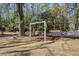 Beautiful yard featuring a charming swing, and lush trees creating a tranquil outdoor space at 425 Ravenwood Rd, Walterboro, SC 29488