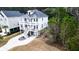 An elevated view of the white home with three stories, showing balconies and neighboring homes at 530 Amalie Farms Dr, Charleston, SC 29492