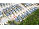 An aerial view shows a picturesque neighborhood and a map pin on the roof of the home at 530 Amalie Farms Dr, Charleston, SC 29492