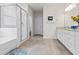Bright bathroom with white cabinets, granite countertops, and tiled floors at 530 Amalie Farms Dr, Charleston, SC 29492