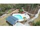 Aerial view of the community pool with palm trees, walking paths, and a nearby bathroom at 530 Amalie Farms Dr, Charleston, SC 29492