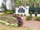 View of the 'St. Thomas Preserve' sign on a brick wall with decorative landscaping at 530 Amalie Farms Dr, Charleston, SC 29492