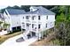 New construction home with a metal roof, white siding, and lots of outdoor porch space at 530 Amalie Farms Dr, Charleston, SC 29492