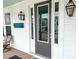 Elegant front door entrance with sidelights, stylish hardware, and welcoming curb appeal at 530 Amalie Farms Dr, Charleston, SC 29492