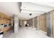 Unfinished garage space with open storage and shelving, concrete walls, and access to the home's exterior at 530 Amalie Farms Dr, Charleston, SC 29492