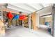 Spacious garage with ample storage for kayaks and paddles at 530 Amalie Farms Dr, Charleston, SC 29492
