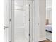 Hallway view of a bathroom with white subway tile and chrome fixtures at 530 Amalie Farms Dr, Charleston, SC 29492