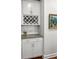 A wine rack in the updated kitchen with white shaker cabinets at 530 Amalie Farms Dr, Charleston, SC 29492