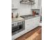Bright kitchen featuring stainless steel appliances, white cabinets, countertops, and a stylish backsplash at 530 Amalie Farms Dr, Charleston, SC 29492