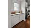 Modern kitchenette featuring white cabinetry, countertops, and stainless steel appliances at 530 Amalie Farms Dr, Charleston, SC 29492