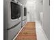 Well-organized laundry area with a side-by-side washer and dryer at 530 Amalie Farms Dr, Charleston, SC 29492
