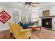 Charming living room featuring a fireplace with white shiplap surround and a dark wooden mantel at 530 Amalie Farms Dr, Charleston, SC 29492